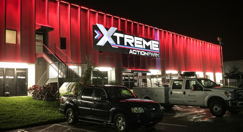 xtreme action park family entertainment center exterior signage design night light