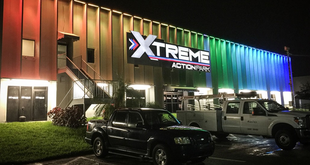 xtreme action park family entertainment center exterior signage design night light